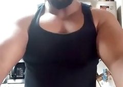 Thick bear strokes his cock and cums all over himself