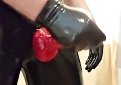 Handjob in a rubber suit