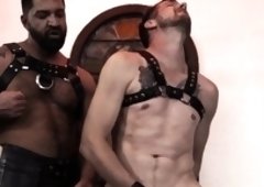BDSM stud assfisted by hunk in leather